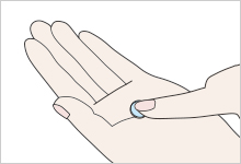 Cup the palm of your hand so that it is in contact with the entire convex surface of the lens, and wash the lens by gently rubbing it by moving your index finger mostly in parallel with the palm of your hand